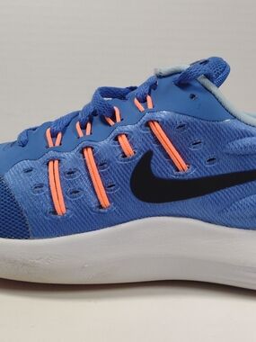 Nike Women's Blue Athletic Sneakers with Orange Accents